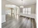 Open floor plan shows dining room, foyer, and wainscoting details at 8270 Mossybrook Ln, Douglasville, GA 30135