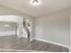 Spacious living room boasts hardwood floors and open floor plan with staircase view at 8270 Mossybrook Ln, Douglasville, GA 30135