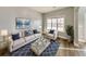 Inviting living room with neutral walls, wood flooring, and abundant natural light at 8270 Mossybrook Ln, Douglasville, GA 30135