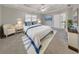 Comfortable bedroom with tray ceilings, neutral colors, and plenty of natural light at 8270 Mossybrook Ln, Douglasville, GA 30135