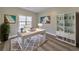 Bright office with a large window, desk, a comfortable chair, and a bookshelf at 8270 Mossybrook Ln, Douglasville, GA 30135