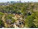 Aerial view of the neighborhood surrounded by green trees, with a city skyline in the distance at 3495 Habersham Nw Rd, Atlanta, GA 30305
