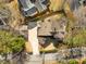 Aerial view showcasing the home's roofline, driveway, and surrounding trees in a well-maintained neighborhood at 3495 Habersham Nw Rd, Atlanta, GA 30305