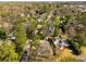 Aerial view of neighborhood showcasing the home among mature trees and nearby streets at 3495 Habersham Nw Rd, Atlanta, GA 30305