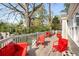 Large back deck with red metal patio furniture for outdoor enjoyment and entertaining at 3495 Habersham Nw Rd, Atlanta, GA 30305