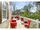 Back deck with red metal patio furniture and partial shade at 3495 Habersham Nw Rd, Atlanta, GA 30305