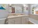 Bright bathroom features a double vanity with marble countertop and a tub/shower combination at 3495 Habersham Nw Rd, Atlanta, GA 30305