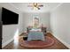 Cozy bedroom features hardwood floors, and a colorful rug at 3495 Habersham Nw Rd, Atlanta, GA 30305