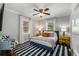 Bedroom featuring large windows, a ceiling fan, and hardwood floors at 3495 Habersham Nw Rd, Atlanta, GA 30305