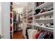 Walk-in closet features custom shelving and hanging rods for ample storage at 3495 Habersham Nw Rd, Atlanta, GA 30305
