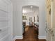 View of living room through an arched entryway, showcasing the hardwood floors and inviting fireplace at 3495 Habersham Nw Rd, Atlanta, GA 30305