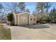 Tan house with a large driveway and mature trees at 3495 Habersham Nw Rd, Atlanta, GA 30305