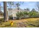 Charming cottage-style home with a yellow door and a partially fenced front yard at 3495 Habersham Nw Rd, Atlanta, GA 30305