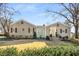 Charming home featuring a yellow door, manicured lawn, and mature trees at 3495 Habersham Nw Rd, Atlanta, GA 30305