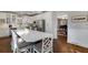 Bright kitchen featuring white cabinetry, stainless steel appliances, and a view into the living room at 3495 Habersham Nw Rd, Atlanta, GA 30305