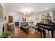 Cozy living room featuring hardwood floors, a fireplace, and ample natural light at 3495 Habersham Nw Rd, Atlanta, GA 30305