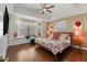 Charming main bedroom features a window seat, trey ceiling, ceiling fan, and hardwood floors at 3495 Habersham Nw Rd, Atlanta, GA 30305