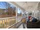 Relaxing screened-in porch with ceiling fans and comfortable seating, perfect for outdoor enjoyment at 3495 Habersham Nw Rd, Atlanta, GA 30305