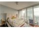 Bedroom with city views and a large window at 1080 Peachtree Ne St # 2710, Atlanta, GA 30309