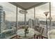 Elegant dining area with city views and large windows at 1080 Peachtree Ne St # 2710, Atlanta, GA 30309