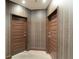 Modern hallway with wood-like flooring and two doors at 1080 Peachtree Ne St # 2710, Atlanta, GA 30309