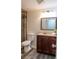 Clean bathroom with wood vanity and updated shower at 1280 W Peachtree Nw St # 2813, Atlanta, GA 30309