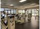 Well-equipped fitness center with various Cybex weight machines and ample natural light at 1280 W Peachtree Nw St # 2813, Atlanta, GA 30309