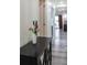 Stylish hallway featuring a mirrored console table and fresh flowers at 1280 W Peachtree Nw St # 2813, Atlanta, GA 30309