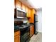 Modern kitchen with wood cabinets and granite countertops at 1280 W Peachtree Nw St # 2813, Atlanta, GA 30309