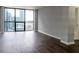 Modern living room with city views and hardwood floors at 1280 W Peachtree Nw St # 2813, Atlanta, GA 30309