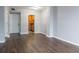 Bright living room featuring hardwood floors and kitchen access at 1280 W Peachtree Nw St # 2813, Atlanta, GA 30309