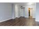 Hardwood floors and neutral walls in this open living room at 1280 W Peachtree Nw St # 2813, Atlanta, GA 30309