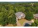 Aerial view of a home nestled among lush greenery at 149 Cedar Woods Trl, Canton, GA 30114