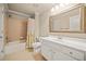 Bathroom featuring a shower/tub combination, a single sink vanity and neutral tones throughout at 149 Cedar Woods Trl, Canton, GA 30114