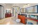 This expansive bathroom features a glass shower, dual vanities with granite counters and generous lighting at 149 Cedar Woods Trl, Canton, GA 30114