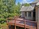 Back deck of the house with wooded backdrop at 149 Cedar Woods Trl, Canton, GA 30114