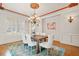 Elegant dining room with bright windows, a decorative ceiling, and sophisticated decor at 149 Cedar Woods Trl, Canton, GA 30114