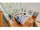 Spacious living room with floor to ceiling windows, a fireplace, hardwood floors and white trim at 149 Cedar Woods Trl, Canton, GA 30114