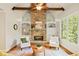 Inviting living room with a stone fireplace, built-in shelving, and plenty of natural light at 149 Cedar Woods Trl, Canton, GA 30114