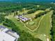 Aerial view of the green golf course and adjacent buildings at 2800 Lillian Ln, Douglasville, GA 30135