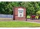 Hunter Park entrance sign with brick pillars and an antique wagon at 2800 Lillian Ln, Douglasville, GA 30135