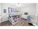 bedroom with a bunk bed, crib, and playful decor at 5402 Highland Preserve Dr, Mableton, GA 30126