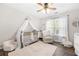 Charming Bedroom features a crib, rocking chair, and ample natural light at 5402 Highland Preserve Dr, Mableton, GA 30126