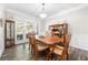 Bright dining room featuring hardwood floors and a large window at 5402 Highland Preserve Dr, Mableton, GA 30126