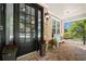 Inviting front porch with brick flooring, a bench, and potted plants at 5402 Highland Preserve Dr, Mableton, GA 30126