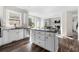 Spacious kitchen featuring an island, stainless steel appliances, and dark hardwood floors at 5402 Highland Preserve Dr, Mableton, GA 30126