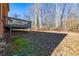 Backyard featuring a deck and mature trees at 6432 Phillips Pl, Lithonia, GA 30058