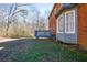 View of the backyard with deck and shade trees at 6432 Phillips Pl, Lithonia, GA 30058