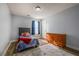 Bedroom featuring carpet flooring and a wooden dresser at 6432 Phillips Pl, Lithonia, GA 30058