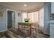 Cozy dining area with lots of light and hardwood floors at 6432 Phillips Pl, Lithonia, GA 30058